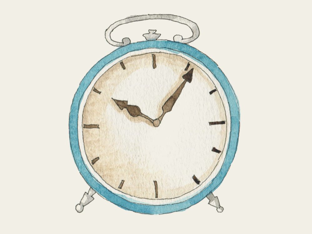 Vintage-style alarm clock with a blue frame on a white background