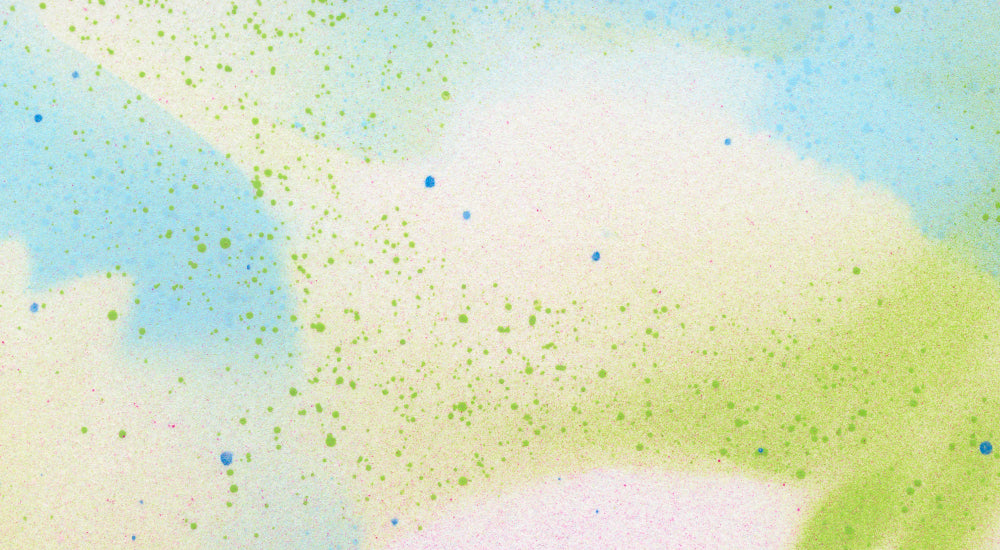Colorful abstract watercolor pattern with green and blue dots on a gradient background