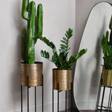 Libra Interiors Clyde Standing Planters in Antique Brass – Set of 2
